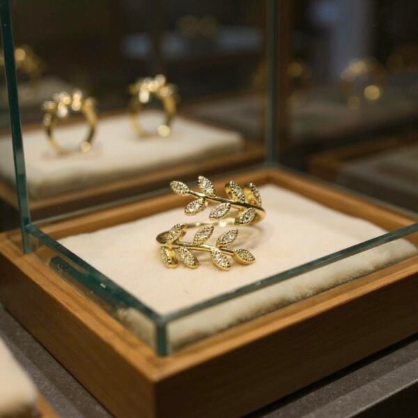 Embrace Italian elegance with this gold-plated wrap ring, featuring two graceful olive branches adorned with sparkling accents. Timeless, delicate, and effortlessly chic.