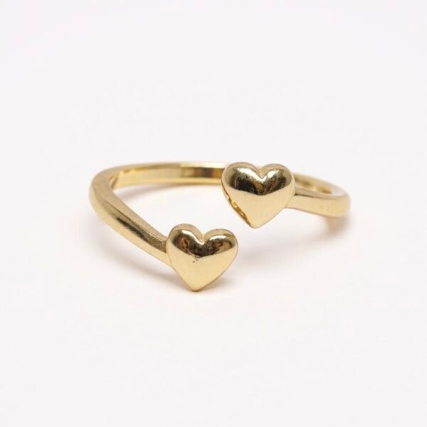 The Cuori Insieme ring beautifully symbolizes the strength of connection bound by love and faith. Two polished gold-plated hearts unite in an open design, representing the unbreakable bond shared between loved ones and the guiding light of faith that strengthens it. The open design also allows the ring to be adjustable, letting you switch between fingers depending on your style of the day—making it as versatile as it is meaningful. Simple yet deeply meaningful, this piece is a reminder that love grows stronger when rooted in faith—making it a cherished everyday accessory or a heartfelt gift.