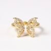 The Farfalla Ring captures the delicate beauty of a butterfly in flight, symbolizing transformation, lightness, and freedom. Crafted in gold-plated brilliance and adorned with sparkling stones, its wings shimmer with every movement, offering a perfect blend of elegance and radiance. A timeless piece that celebrates grace and resilience, Farfalla is designed to inspire and enchant.