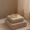 The Onda Ring draws inspiration from the ever-shifting rhythm of the sea. Its fluid, wave-like curves are sculpted in a luminous gold-plated finish, capturing both grace and strength. This open, adjustable design embodies balance and flow while offering a contemporary minimalist silhouette. A versatile piece, Onda transitions effortlessly from everyday wear to statement styling, making it a timeless reflection of elegance in motion.