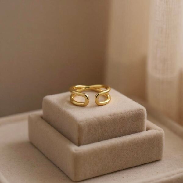 The Onda Ring draws inspiration from the ever-shifting rhythm of the sea. Its fluid, wave-like curves are sculpted in a luminous gold-plated finish, capturing both grace and strength. This open, adjustable design embodies balance and flow while offering a contemporary minimalist silhouette. A versatile piece, Onda transitions effortlessly from everyday wear to statement styling, making it a timeless reflection of elegance in motion.