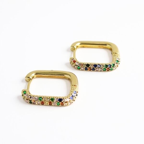 Bring a burst of color to your everyday style with the Arcobaleno Earrings, a celebration of vibrant beauty. Crafted in gold-plated brass, these rectangular hoops are adorned with multicolored crystal stones that sparkle with every movement. Perfect for both casual chic and evening glamour, they add a playful yet elegant touch to your look. Lightweight, versatile, and radiant, the Arcobaleno Earrings are the perfect accessory to brighten your day.