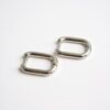 The Argento Puro earrings embody sleek sophistication with their minimalist rectangular hoop silhouette in high-polished sterling silver. Designed for those who love understated elegance, these versatile earrings transition seamlessly from day to night, adding a refined edge to any look. Their lightweight design ensures comfort, while their timeless finish makes them a staple piece for your jewelry collection.