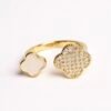 The Quadrifoglio ring celebrates the rarity of the four-leaf clover, a universal symbol of luck, hope, and faith. One clover gleams with dazzling cubic zirconia, while the other glows with a soft mother-of-pearl inlay — a balance of brilliance and serenity. The open band design allows for an adjustable fit, making it as versatile as it is meaningful. Expertly crafted in gold-plated brass, this ring is a refined token of elegance and good fortune, perfect for everyday wear or as a thoughtful gift.
