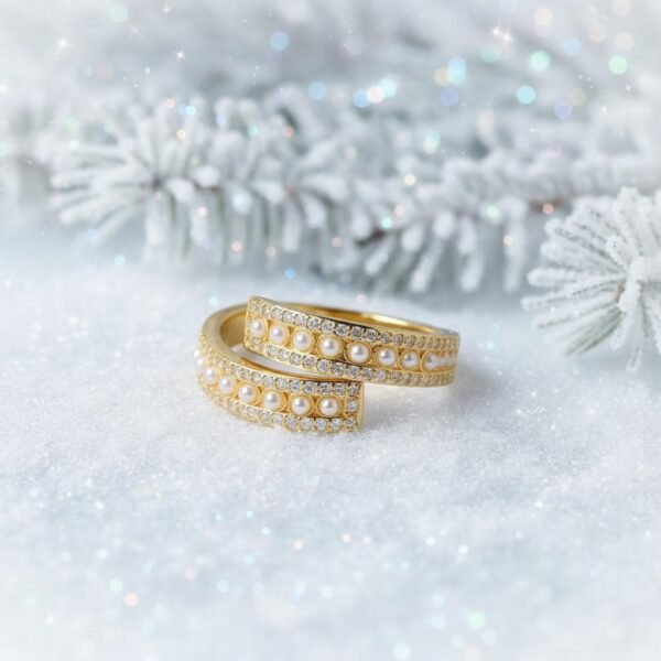 Elegance at first light. The Aurora Ring radiates refined beauty with its open-band design, delicately adorned with rows of miniature pearls and sparkling stones. Crafted in a gold-plated finish, it captures the soft glow of dawn, symbolizing hope, renewal, and timeless elegance. Its graceful curve allows the pearls to glisten like the first morning light, making it a versatile piece that elevates any look, whether worn solo or paired with your favorite Bella Pia jewels.