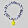 The Limoncello Mini Bracelet is a delicate take on our signature Limoncello design, created for those who love subtle elegance. Featuring smaller blue-and-white floral beads paired with a playful lemon charm, it offers a lighter, refined option while keeping the same joyful Mediterranean spirit. Perfect for everyday wear or stacked alongside the full-sized Limoncello Bracelet, this piece is a refreshing nod to Italian tradition with a modern, breezy charm.
