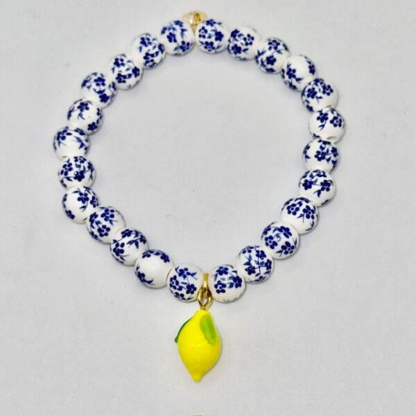 The Limoncello Mini Bracelet is a delicate take on our signature Limoncello design, created for those who love subtle elegance. Featuring smaller blue-and-white floral beads paired with a playful lemon charm, it offers a lighter, refined option while keeping the same joyful Mediterranean spirit. Perfect for everyday wear or stacked alongside the full-sized Limoncello Bracelet, this piece is a refreshing nod to Italian tradition with a modern, breezy charm.