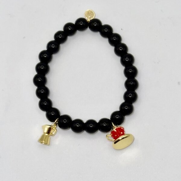 Inspired by Italy’s love affair with coffee, the Caffè Amore Bracelet pairs sleek black beads with two gold-plated charms — a moka pot and a red espresso cup — celebrating the warmth of a morning brew and the art of connection. Perfect for coffee lovers and anyone who treasures la dolce vita, this playful yet elegant bracelet adds a touch of Italian charm to any outfit.