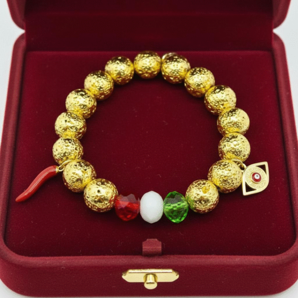 Celebrate your heritage with the Italia Amuleto bracelet — a bold fusion of Italian tradition and protective symbolism. Featuring radiant gold-tone textured beads paired with faceted crystals in the colors of the Italian flag, this bracelet is adorned with two powerful charms: the iconic red cornicello horn for good fortune and the protective evil eye to ward off negativity. Perfect for everyday wear or as a statement of cultural pride, it’s more than jewelry — it’s a talisman of heritage, luck, and love.
