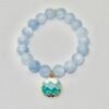 Inspired by the calming rhythm of the ocean, the Onda bracelet features soothing blue jade beads paired with a gold-plated ocean wave charm. This piece is more than just a beautiful accessory—it’s a symbol of hope and joy. A portion of proceeds from every Onda bracelet is donated to the Best Day Foundation, a non-profit dedicated to helping children and young adults with special needs build confidence and have fun through adventure activities like surfing. Wear the Onda bracelet to show your love for the sea and your support for making every day the best day for someone in need.