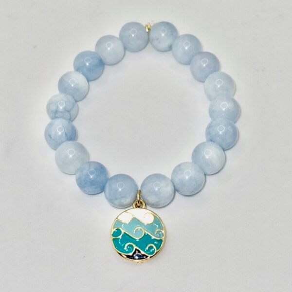 Inspired by the calming rhythm of the ocean, the Onda bracelet features soothing blue jade beads paired with a gold-plated ocean wave charm. This piece is more than just a beautiful accessory—it’s a symbol of hope and joy. A portion of proceeds from every Onda bracelet is donated to the Best Day Foundation, a non-profit dedicated to helping children and young adults with special needs build confidence and have fun through adventure activities like surfing. Wear the Onda bracelet to show your love for the sea and your support for making every day the best day for someone in need.