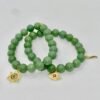 The Stella Verde bracelet features smooth green jade beads, paired with a radiant gold-plated Star of David charm accented in vibrant pink and green crystals. This piece embodies spiritual strength and balance, serving as a guiding light and a grounding connection to nature. Wear it alone for a statement of faith and serenity, or stack it for layered harmony.