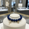 The Fede Blu Bracelet embodies timeless devotion and elegance. Crafted with deep blue polished beads, it symbolizes serenity and strength. Accented with two gold-plated charms—a sparkling pavé cross and a delicate quatrefoil—it represents faith, balance, and divine protection. Whether worn alone or stacked with complementary designs, this bracelet brings a touch of Italian sophistication and spiritual meaning to every moment. Pair the Fede Blu Bracelet with the Verde Classico Bracelet for a bold yet harmonious combination. The deep navy blue beads of Fede Blu reflect wisdom and strength, while the rich green tones of Verde Classico symbolize renewal and prosperity. Together, accented with gold-plated charms of faith and fortune, this stack becomes a powerful expression of balance, protection, and timeless Italian elegance. Wear them stacked for a statement look that transitions seamlessly from day to evening.
