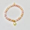 The Amore di Bellezza bracelet is designed as a symbol of devotion and elegance. Crafted with beads natural stone beads—choose from soft rose jade or calming green jade—each piece is accented with a delicate heart-shaped lock charm gold-plated or silver-toned. Sold individually, these bracelets are perfect on their own but even more striking when stacked together, allowing you to mix colors and finishes for a personalized statement of love and beauty.