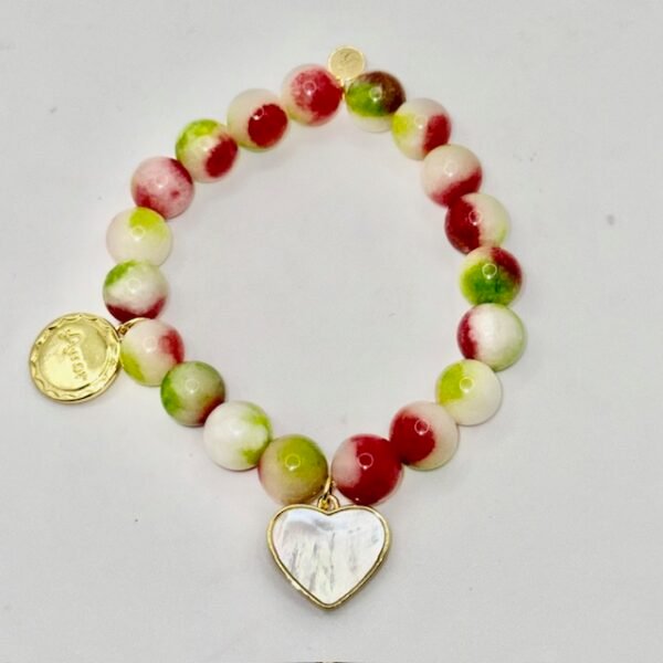 Dolce Amor, or Sweet Love in Beauty, is a joyful celebration of love and life. Designed with vibrant watermelon jade stones in refreshing shades of green, white, and pink, this bracelet captures the freshness of gelato and the warmth of affection. A luminous mother-of-pearl heart charm, gold-plated framed, and Amor gold-plated charm symbolizes purity, devotion, and timeless love. Playful yet elegant, it’s the perfect piece to wear alone or stacked with other Bella Pia favorites for a bold expression of amore.