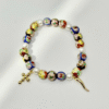 Celebrate your heritage with the Italia Amuleto bracelet — a bold fusion of Italian tradition and protective symbolism. Featuring radiant gold-tone textured beads paired with faceted crystals in the colors of the Italian flag, this bracelet is adorned with two powerful charms: the iconic red cornicello horn for good fortune and the protective evil eye to ward off negativity. Perfect for everyday wear or as a statement of cultural pride, it’s more than jewelry — it’s a talisman of heritage, luck, and love.