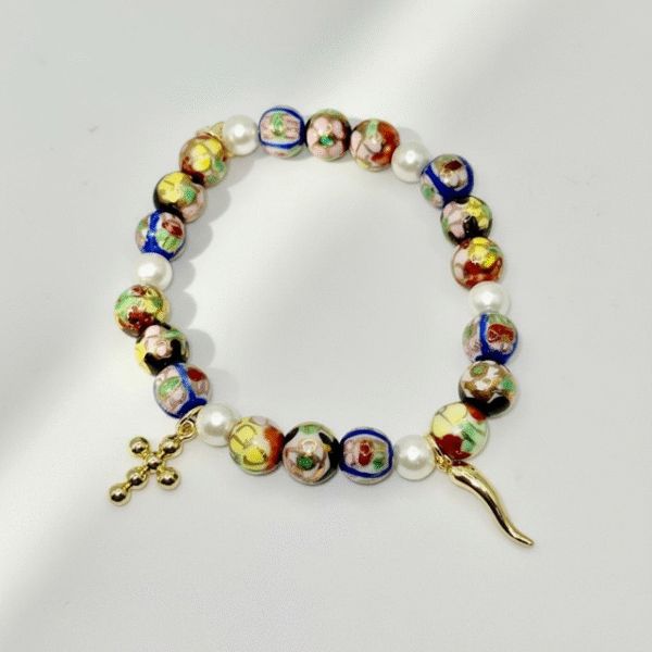 Celebrate your heritage with the Italia Amuleto bracelet — a bold fusion of Italian tradition and protective symbolism. Featuring radiant gold-tone textured beads paired with faceted crystals in the colors of the Italian flag, this bracelet is adorned with two powerful charms: the iconic red cornicello horn for good fortune and the protective evil eye to ward off negativity. Perfect for everyday wear or as a statement of cultural pride, it’s more than jewelry — it’s a talisman of heritage, luck, and love.