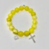 The Sole Benedetto bracelet radiates light and protection. Crafted from vibrant yellow jade stones, it carries the warmth and positivity of the sun. Accented with a sparkling silver pavé cross and a shimmering silver quadrifoglio (four-leaf clover), this piece is a powerful symbol of faith, luck, and divine blessings. Whether worn alone or stacked, it is a timeless reminder of grace and strength.