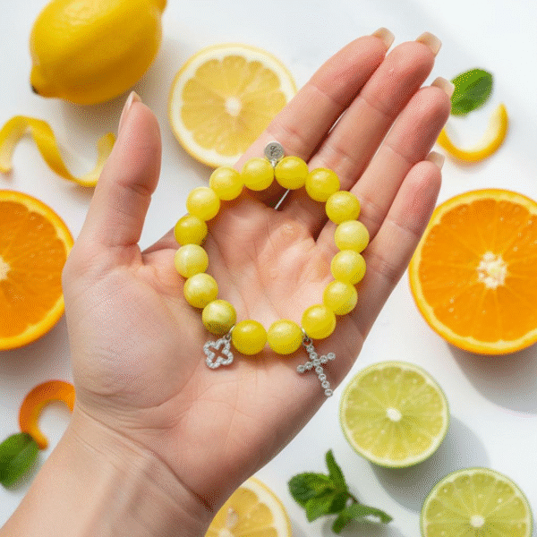 The Sole Benedetto bracelet radiates light and protection. Crafted from vibrant yellow jade stones, it carries the warmth and positivity of the sun. Accented with a sparkling silver pavé cross and a shimmering silver quadrifoglio (four-leaf clover), this piece is a powerful symbol of faith, luck, and divine blessings. Whether worn alone or stacked, it is a timeless reminder of grace and strength.