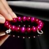 Celebrate heritage, unity, and strength with our Star of David Bracelet. Featuring vibrant magenta stone beads, this bracelet is adorned with a silver sparkling Star of David charm and a silver horseshoe for luck. A meaningful piece that intertwines tradition with contemporary elegance, it offers both protection and beauty in every detail. Wear it solo as a bold expression of faith, or stack it with the green jade bracelet for a striking contrast that symbolizes balance, renewal, and protection.