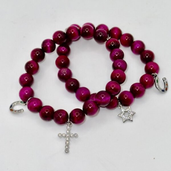 Embody faith and strength with our Cross Bracelet, crafted from rich magenta stones that radiate elegance and inner power. Accented with a delicate silver crystal-encrusted cross and a silver symbolic horseshoe charm, this bracelet blends timeless spirituality with a touch of fortune. A versatile piece that transitions seamlessly from everyday wear to special occasions, it’s designed to be both a symbol of devotion and a statement of style. Wear it solo as a bold expression of faith, or stack it with the green jade bracelet for a striking contrast that symbolizes balance, renewal, and protection.