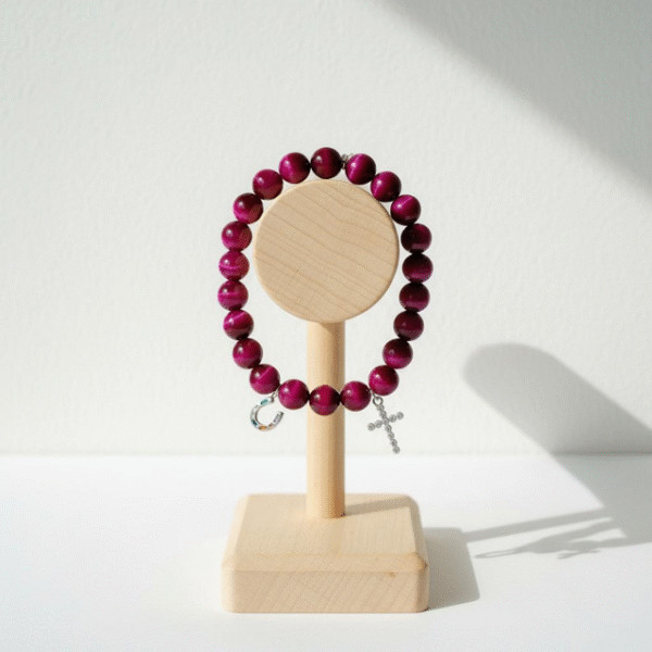 Celebrate heritage, unity, and strength with our Star of David Bracelet. Featuring vibrant magenta stone beads, this bracelet is adorned with a silver sparkling Star of David charm and a silver horseshoe for luck. A meaningful piece that intertwines tradition with contemporary elegance, it offers both protection and beauty in every detail. Wear it solo as a bold expression of faith, or stack it with the green jade bracelet for a striking contrast that symbolizes balance, renewal, and protection.