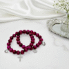 Celebrate heritage, unity, and strength with our Star of David Bracelet. Featuring vibrant magenta stone beads, this bracelet is adorned with a silver sparkling Star of David charm and a silver horseshoe for luck. A meaningful piece that intertwines tradition with contemporary elegance, it offers both protection and beauty in every detail. Wear it solo as a bold expression of faith, or stack it with the green jade bracelet for a striking contrast that symbolizes balance, renewal, and protection.
