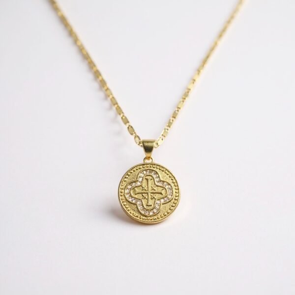 The Benedetta necklace captures timeless grace with a gold-plated round medallion pendant, intricately detailed with a radiant cross framed in shimmering crystals. Inspired by devotion and elegance, this piece blends strength of faith with classic Italian artistry. A meaningful heirloom design to wear close to your heart, Benedetta is a symbol of protection, hope, and everlasting style