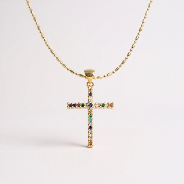 The Arcobaleno Cross Necklace shines with the brilliance of a rainbow, a symbol of faith, promise, and new beginnings. Crafted with multicolored stones set in a gold-plated cross, this piece embodies joy and divine light, reminding the wearer of beauty in diversity and strength in faith. A vibrant expression of devotion, it is perfect for daily wear or as a meaningful gift.