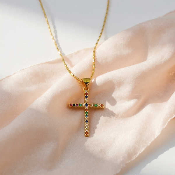 The Arcobaleno Cross Necklace shines with the brilliance of a rainbow, a symbol of faith, promise, and new beginnings. Crafted with multicolored stones set in a gold-plated cross, this piece embodies joy and divine light, reminding the wearer of beauty in diversity and strength in faith. A vibrant expression of devotion, it is perfect for daily wear or as a meaningful gift.