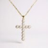The Croce di Aurora is a luminous expression of timeless devotion and elegance. Crafted in a gold-plated finish and adorned with radiant pearls, this cross necklace embodies purity and light. Its delicate detailing and refined symmetry make it a piece of spiritual beauty as well as a sophisticated accessory. Perfect for both meaningful occasions and everyday wear, this pendant radiates serenity and faith.