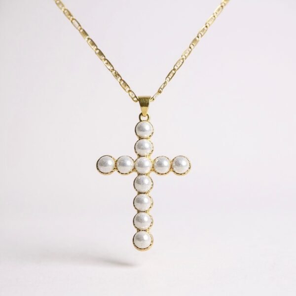 The Croce di Aurora is a luminous expression of timeless devotion and elegance. Crafted in a gold-plated finish and adorned with radiant pearls, this cross necklace embodies purity and light. Its delicate detailing and refined symmetry make it a piece of spiritual beauty as well as a sophisticated accessory. Perfect for both meaningful occasions and everyday wear, this pendant radiates serenity and faith.