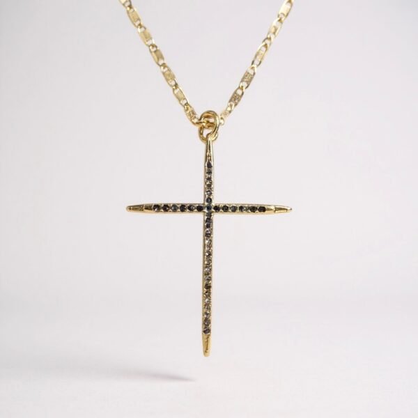 The Fede Azzurra necklace is a timeless emblem of devotion, designed with luminous blue stones that reflect peace, clarity, and spiritual depth. Its slender gold-plated frame elevates the brilliance of the stones, creating a refined cross that balances elegance with meaning. This piece serves as both a statement of faith and a versatile accessory, perfect for everyday wear or as a meaningful gift.