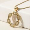 The I Speak Fluent Gucci necklace is a bold expression of style and sophistication. Featuring an open circular pendant crafted from interlinked, pavé crystal-encrusted links, it radiates modern elegance while paying homage to the iconic chain motifs of Italian couture. Suspended from a sleek gold-toned chain, this necklace is designed for those who carry luxury in their language and confidence in their presence. Perfect as a standalone statement or layered with other Bella Pia pieces, it embodies fashion as fluent as your voice.
