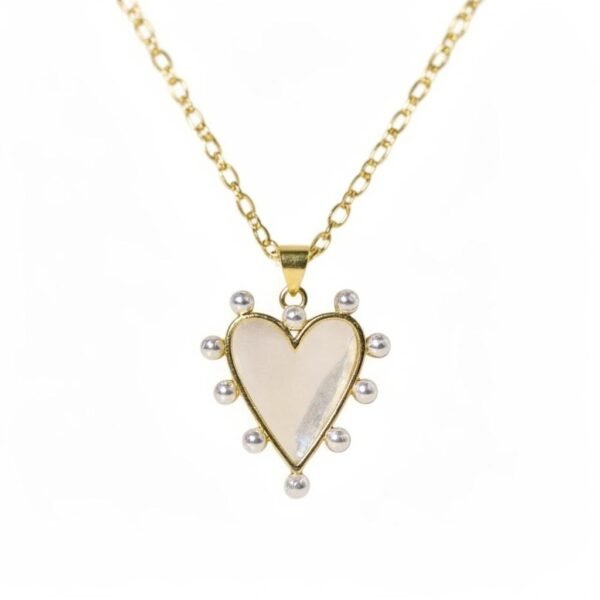 "Luna" Where dreams drift in moonlight. The Luna Necklace is a celestial-inspired heart pendant crafted with luminous mother-of-pearl framed in gold-plated, surrounded by delicate pearls. Its ethereal glow captures the magic of moonlight, making it a timeless symbol of love, serenity, and dreams. Designed for those who carry grace and elegance wherever they go, Luna is perfect for both everyday wear and special occasions. Designed to transition effortlessly from everyday moments to special occasions, the Luna Necklace is perfect worn alone as a soft statement or layered with other Bella Pia favorites. A graceful reminder that beauty, light, and dreams are always within reach.