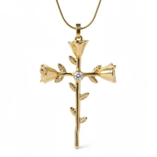 "Rosario" Devotion blooms like a rose. The Rosario Necklace beautifully intertwines devotion and nature’s elegance. Crafted in gold-plated, this pendant forms a cross made of delicate rose blooms, symbolizing love, faith, and eternal beauty. A sparkling center stone adds a touch of brilliance, making it both a meaningful keepsake and a timeless accessory. Perfect for those who want to carry faith and grace close to their heart. A softly sparkling center stone adds a touch of light, creating a meaningful piece designed to be worn close to the heart, perfect for everyday wear or special moments.