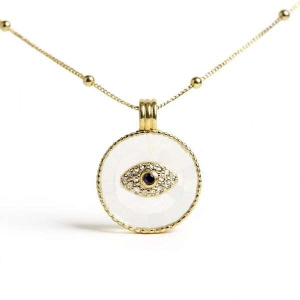 "Occhio" Protection in every glance. The Occhio Rosa and Occhio Bianco necklaces combine timeless tradition with modern elegance. Handcrafted with shimmering mother-of-pearl mosaics in soft blush pink or luminous white, each pendant features a sapphire-blue centerpiece surrounded by sparkling crystals, symbolizing the ancient talisman of the “evil eye.” Set in gold-plated detailing, these pendants are not only radiant accessories but also protective charms, believed to ward off negative energy while elevating any look. Designed to be worn close to the heart, the Occhio necklaces serve as both elegant accessories and modern talismans, believed to ward off negative energy while bringing balance, intention, and light to everyday style. Perfect worn alone or layered with other Bella Pia favorites, they are timeless pieces meant to protect, empower, and elevate every look.
