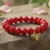 The Angalia Cuore bracelet is handcrafted with luminous red facted crystal beads, finished with a gleaming gold-plated heart charm etched in leopard detail. A radiant symbol of fierce love and fearless style, this bracelet is designed to catch the light and elevate any look. Whether worn solo as a statement piece or stacked for extra drama, Angalia Cuore is elegance with an edge. This bracelet looks beautiful on its own but truly shines when stacked with the classic black beaded bracelet. The bold red and gold heart charm create a striking contrast when paired with black, making it perfect for day-to-night elegance.