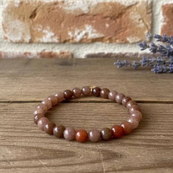 The Terra di Sole bracelet is a natural celebration of strength, balance, and grounding energy. The sunstone beads are rich terracotta and earthy hues, this piece radiates warmth and inner vitality. Known as the “stone of joy,” sunstone inspires confidence and creativity while promoting harmony in daily life. Its earthy palette makes it a versatile accessory—effortlessly transitioning from casual wear to elevated style. Wear Terra di Sole as a daily reminder of your resilience, your light, and your connection to the beauty of nature.