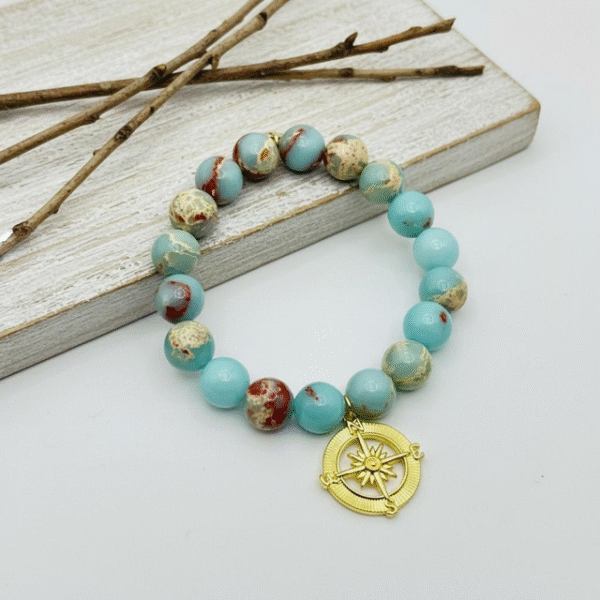 The Viaggio Elena bracelet is a celebration of life’s journeys, guided by faith, friendship, and family. Hand-strung with ocean-hued stones, each bead reflects the flow of life’s adventures, while the gold-plated compass charm reminds us of the bonds that anchor us. Whether gifted to a loved one or worn as a personal talisman, this bracelet symbolizes the ties of friendship and the strength of family that carry us through every chapter. Elegant alone or stacked with other Bella Pia favorites, Viaggio Elena is a keepsake that honors love, connection, and the guiding light of togetherness.