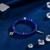 Bold yet refined, the Christina Blu bracelet is where high fashion meets inner strength. A sleek silver cross glistens beneath a halo of sapphire-blue crystals, creating a statement piece that embodies confidence and elegance. Designed for the modern woman who commands the boardroom, the dance floor, and everything in between, this bracelet transitions effortlessly from gym chic to nightlife glamour. Wear it as your signature accessory — a fashion-forward emblem of resilience, devotion, and style.