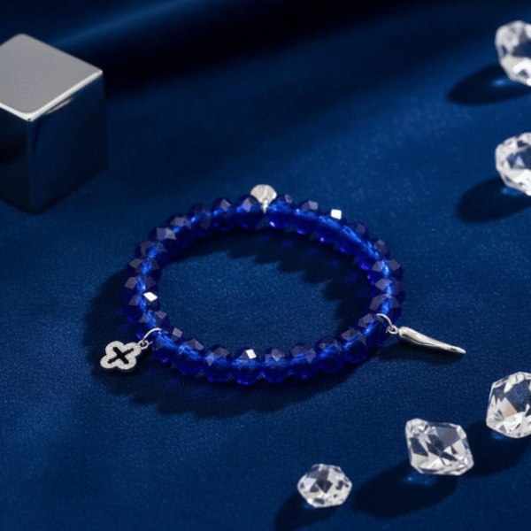 Bold yet refined, the Christina Blu bracelet is where high fashion meets inner strength. A sleek silver cross glistens beneath a halo of sapphire-blue crystals, creating a statement piece that embodies confidence and elegance. Designed for the modern woman who commands the boardroom, the dance floor, and everything in between, this bracelet transitions effortlessly from gym chic to nightlife glamour. Wear it as your signature accessory — a fashion-forward emblem of resilience, devotion, and style.