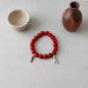 Channel centuries of Italian tradition with the Corno & Mano Fortuna Bracelet. Crafted with bold red marbled beads, this striking bracelet features two of the most powerful amulets of protection: the red cornicello (Italian horn) to ward off envy and misfortune, and the Mano Cornuto (horned hand) charm in silver or gold to shield against the evil eye. Together, they create a timeless talisman of resilience, passion, and luck. Designed to be unisex, this bracelet blends symbolic heritage with modern elegance—perfect for anyone seeking both style and strength in everyday wear.