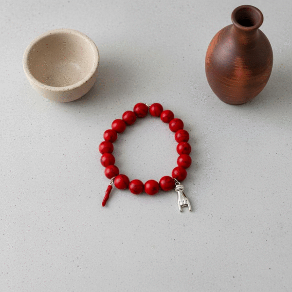 Channel centuries of Italian tradition with the Corno & Mano Fortuna Bracelet. Crafted with bold red marbled beads, this striking bracelet features two of the most powerful amulets of protection: the red cornicello (Italian horn) to ward off envy and misfortune, and the Mano Cornuto (horned hand) charm in silver or gold to shield against the evil eye. Together, they create a timeless talisman of resilience, passion, and luck. Designed to be unisex, this bracelet blends symbolic heritage with modern elegance—perfect for anyone seeking both style and strength in everyday wear.