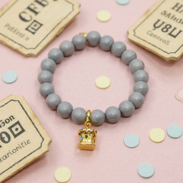 The Mama’s Carosello Bracelet captures the magic of cherished memories and the joy of motherhood. Designed with smooth gray beads for an elegant base, it features a hand-painted gold-plated carousel charm—carosello in Italian—that symbolizes love, nostalgia, and the playful spirit of family. A meaningful piece that makes a thoughtful gift for moms and anyone who treasures life’s sweetest moments.