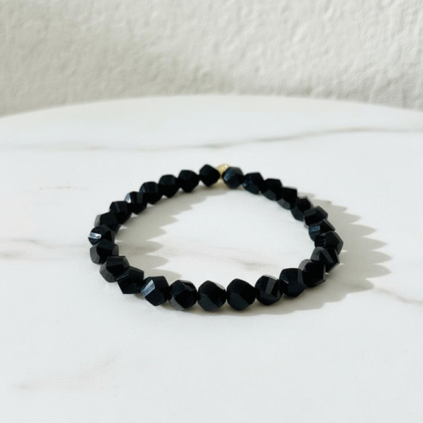 The La Notte Bracelet is inspired by the elegance and mystery of the Italian night sky. Crafted with bold, crystal faceted black beads, its striking geometric design catches the light with every movement—making it the perfect statement piece. Whether worn solo for a sleek look or stacked with other Bella Pia favorites, this bracelet embodies effortless sophistication and strength.