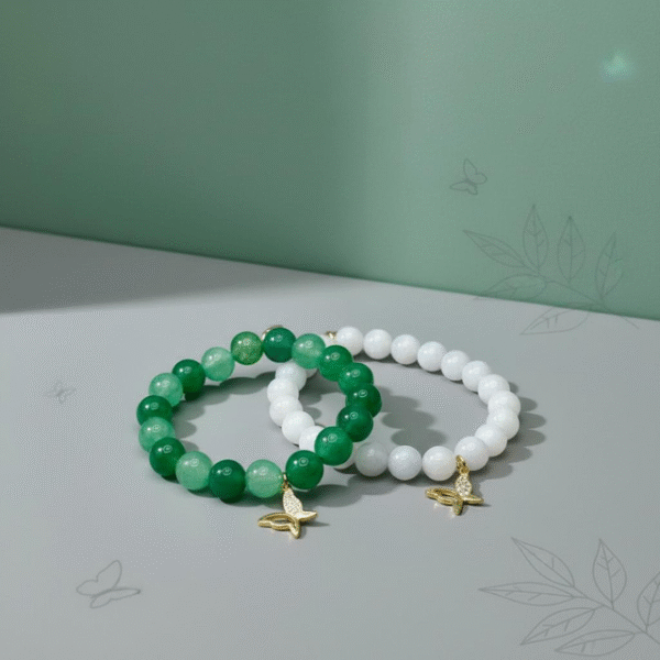The Farfalla Bracelet is a celebration of renewal and elegance. Featuring radiant green jade beads symbolizing harmony and growth, it is adorned with a delicate gold-plated butterfly charm accented with shimmering stones. The butterfly, or farfalla in Italian, is a timeless emblem of transformation, freedom, and beauty. A versatile piece designed to uplift any look, it carries both style and meaning.