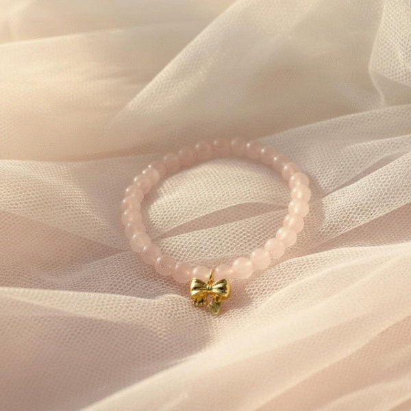 The Ella Bella Fiocco Bracelet is a delicate celebration of femininity and charm. Soft pink rose quartz beads, this piece features a dainty bow charm available in silver or gold-plated finishes. Perfect on its own or layered with other Ella Bella favorites, it’s a sweet symbol of grace, elegance, and playful sophistication. A bracelet that feels as special as the little moments it’s made to honor.