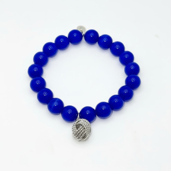 The Nodo D&G Bracelet is a heartfelt tribute to the unbreakable bond between mother and sons. Handcrafted with radiant sapphire-blue stones, it radiates strength, clarity, and devotion. At its center rests a beautifully detailed silver knot charm — a timeless symbol of connection, loyalty, and love that can never be undone. Whether worn as a daily reminder of cherished family ties or as a statement of elegance, Nodo D&G embodies both meaning and style. A piece that moves seamlessly from casual wear to evening elegance, it’s more than jewelry — it’s a story of family, heritage, and devotion