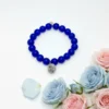 The Nodo D&G Bracelet is a heartfelt tribute to the unbreakable bond between mother and sons. Handcrafted with radiant sapphire-blue stones, it radiates strength, clarity, and devotion. At its center rests a beautifully detailed silver knot charm — a timeless symbol of connection, loyalty, and love that can never be undone. Whether worn as a daily reminder of cherished family ties or as a statement of elegance, Nodo D&G embodies both meaning and style. A piece that moves seamlessly from casual wear to evening elegance, it’s more than jewelry — it’s a story of family, heritage, and devotion